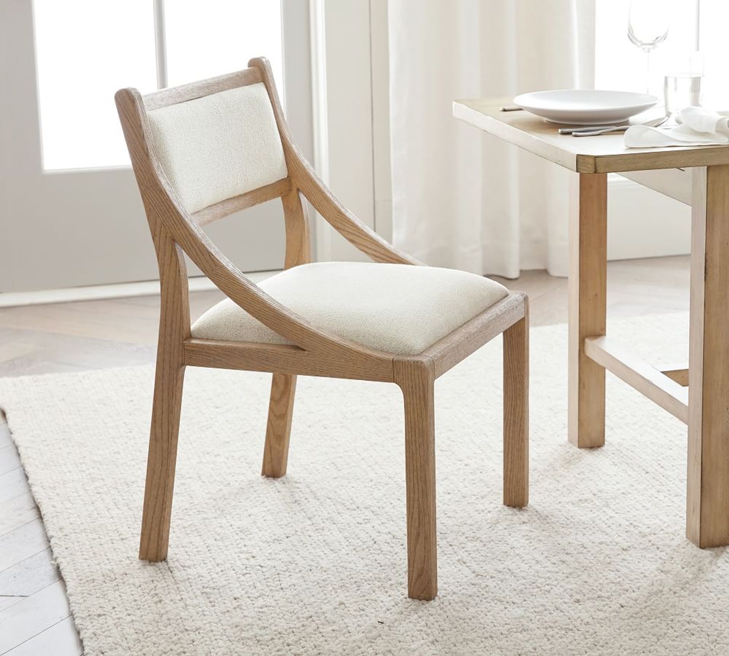 Shop Lyell Upholstered Dining Chairs from Pottery Barn on Openhaus